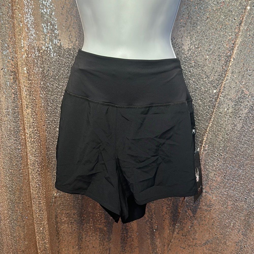 Spyder women’s L running shorts with inner liner. zipper in back. New with tag